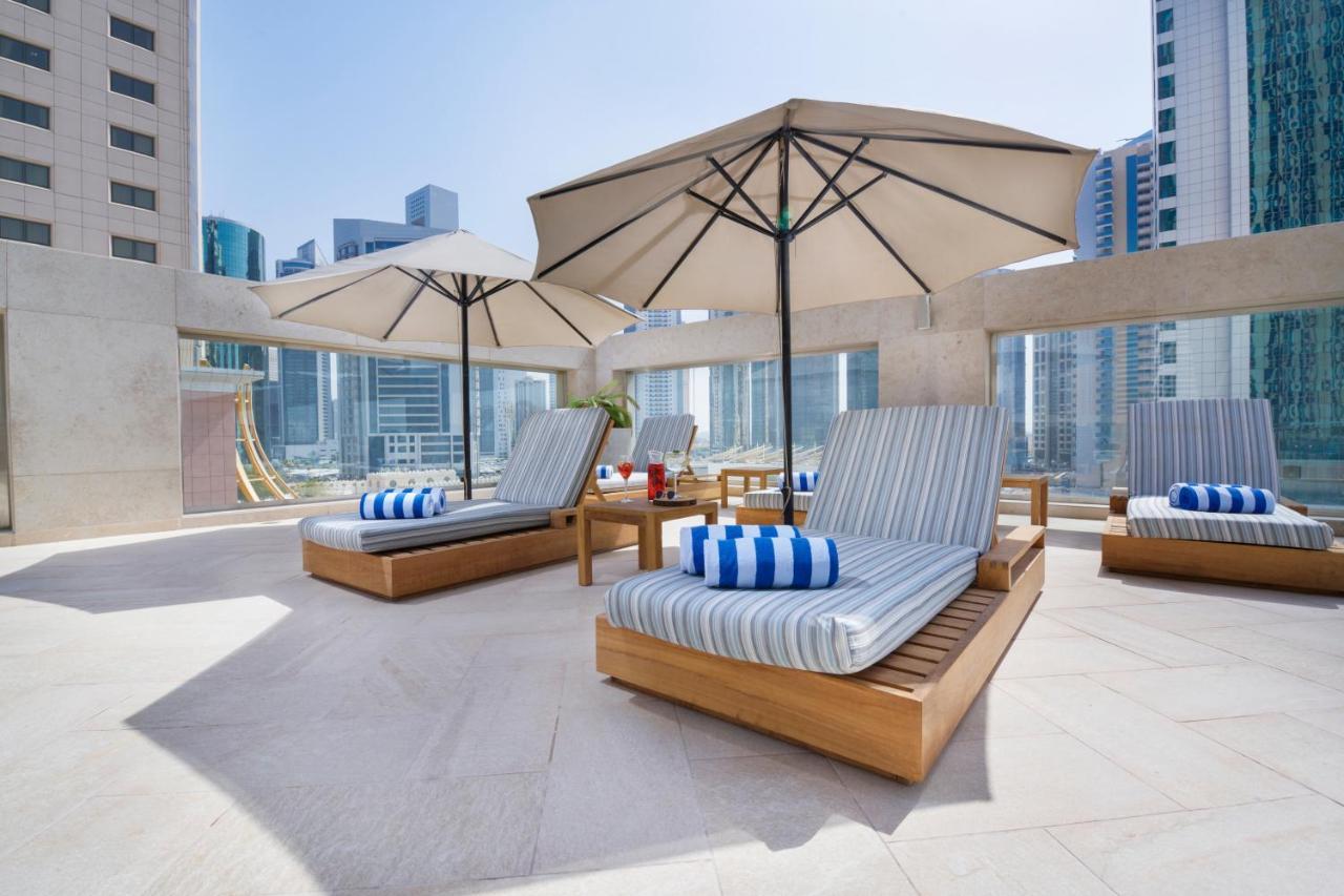 Wyndham Grand Doha West Bay Beach Exteriör bild The pool deck at the hotel