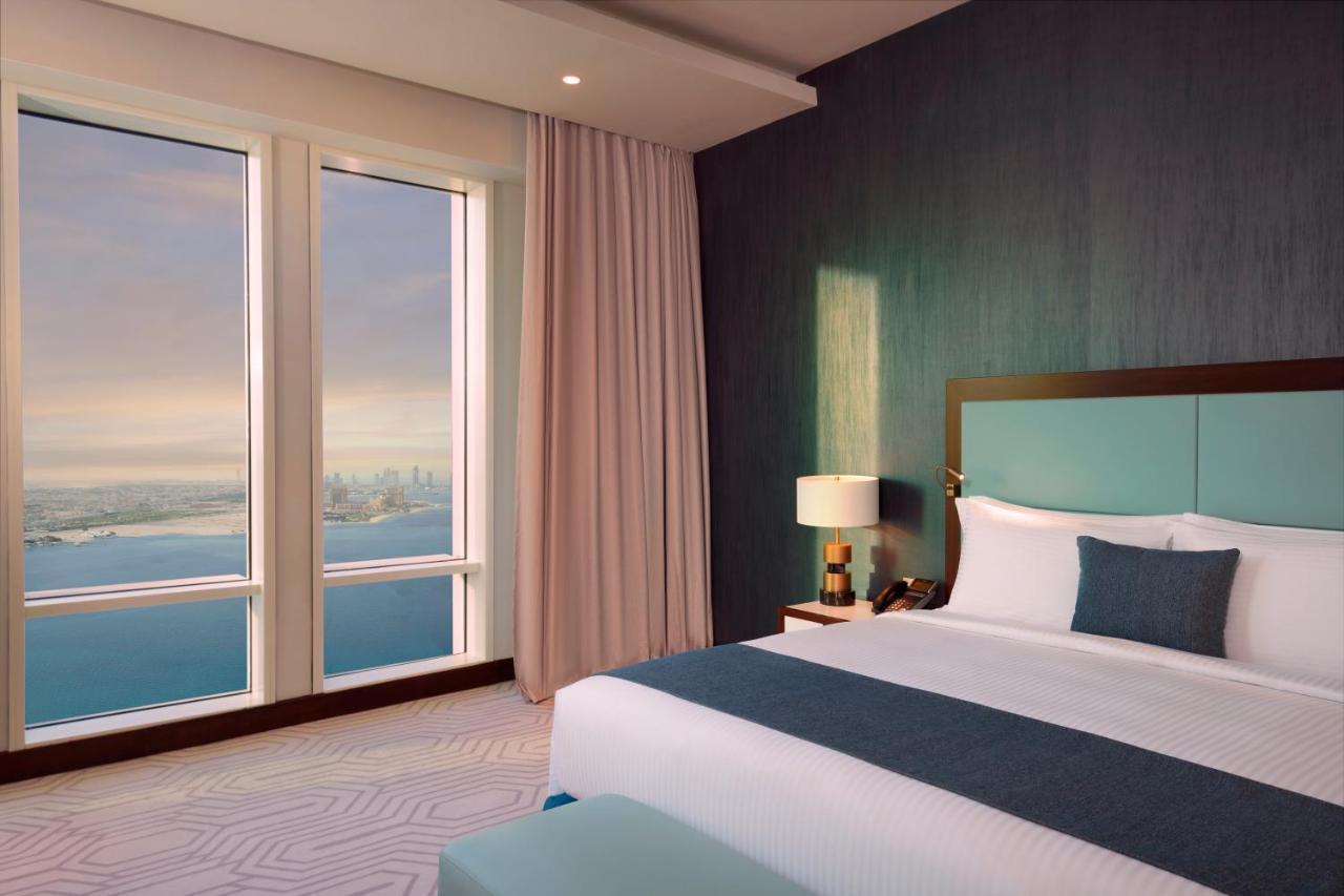 Wyndham Grand Doha West Bay Beach Exteriör bild A bedroom at the Address Downtown Dubai